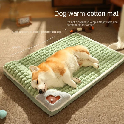 A dog lying comfortably on a green Petzaroo warm dog sleeping pad with a non-slip base.

